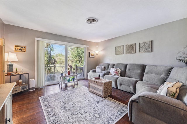 living room with dark hardwood / wood-style floors