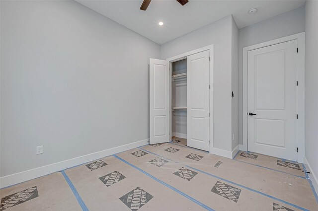 unfurnished bedroom with a closet and ceiling fan