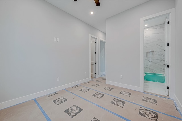 unfurnished bedroom with connected bathroom and ceiling fan