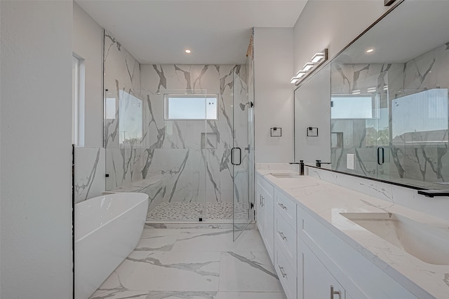 bathroom with separate shower and tub and vanity