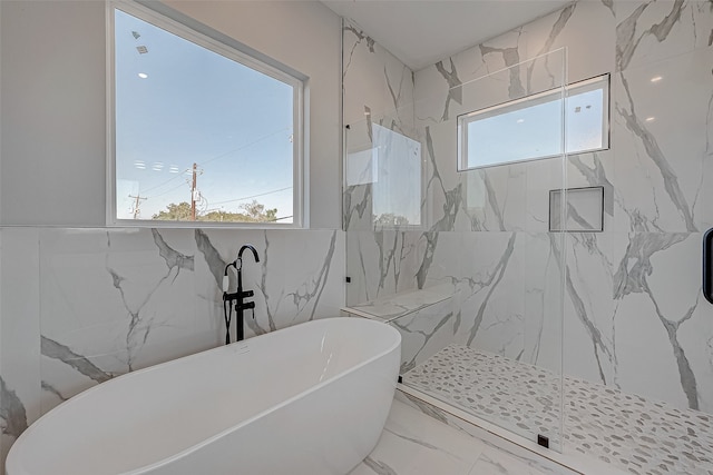 bathroom featuring independent shower and bath and tile walls