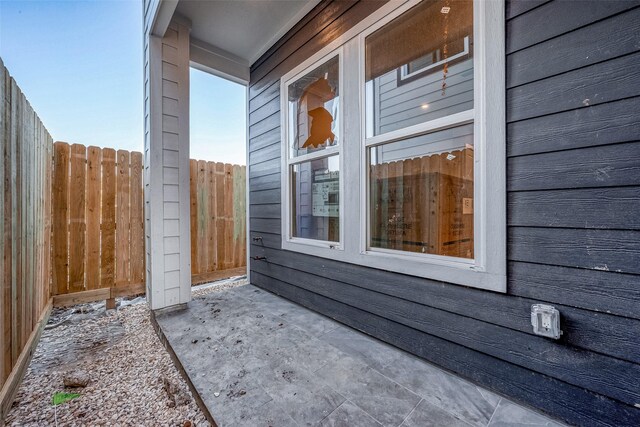 view of side of property featuring a patio