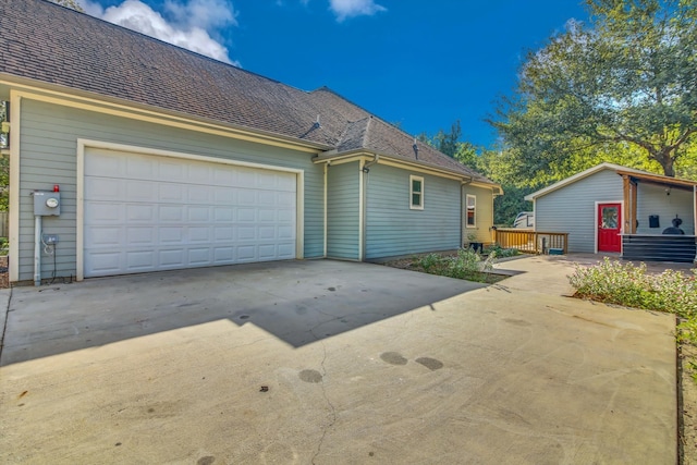 exterior space with a deck and a garage