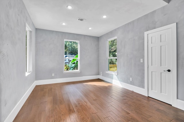 empty room with light hardwood / wood-style floors