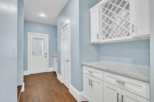 hallway with dark hardwood / wood-style floors