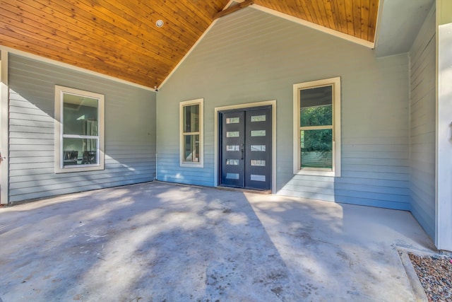 view of exterior entry featuring a patio area