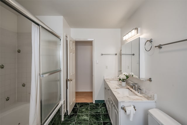 full bathroom featuring shower / bath combination with curtain, toilet, and vanity