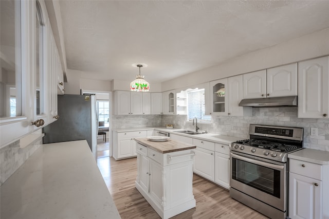 kitchen featuring appliances with stainless steel finishes, a center island, and white cabinets