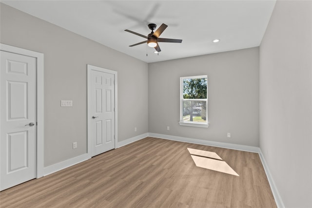 unfurnished room with light hardwood / wood-style floors and ceiling fan