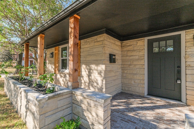 entrance to property with a porch