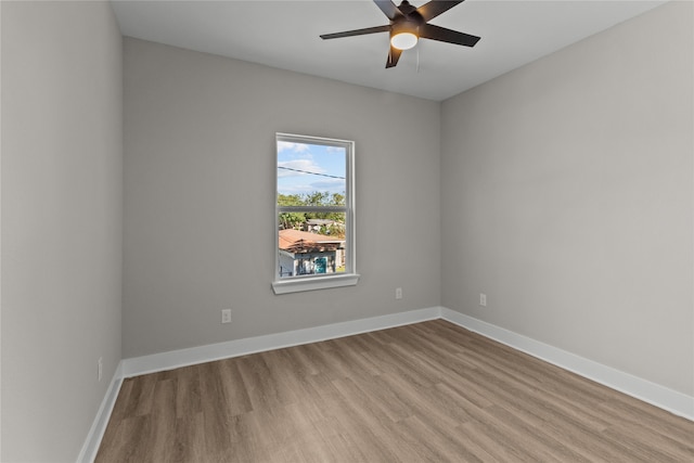 empty room featuring ceiling fan and light hardwood / wood-style flooring