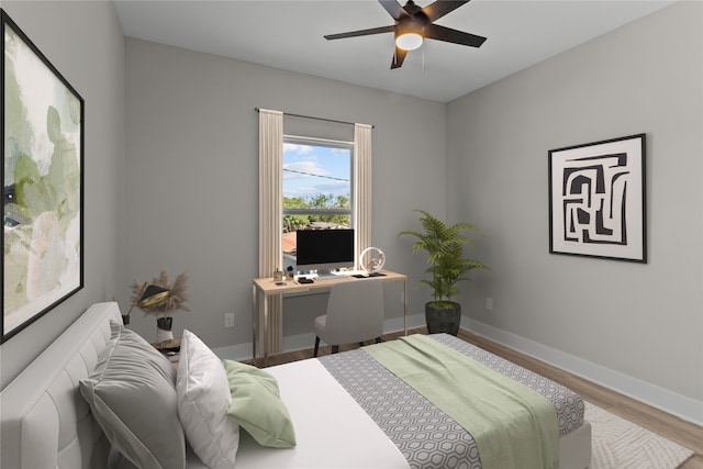 bedroom with hardwood / wood-style flooring and ceiling fan