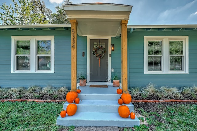 doorway to property featuring a porch