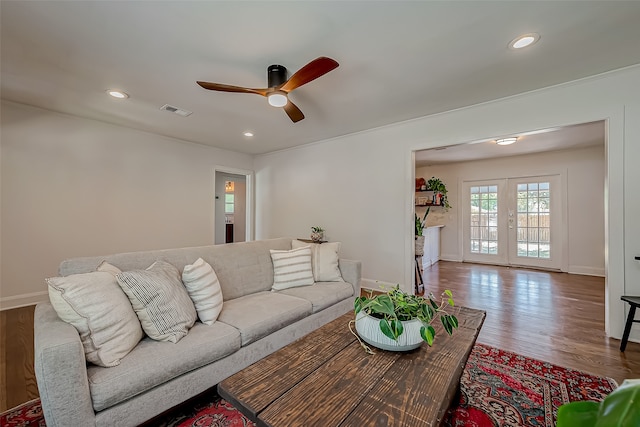 living room featuring french doors, hardwood / wood-style flooring, and ceiling fan