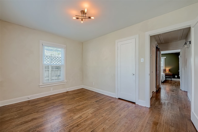 spare room with hardwood / wood-style flooring