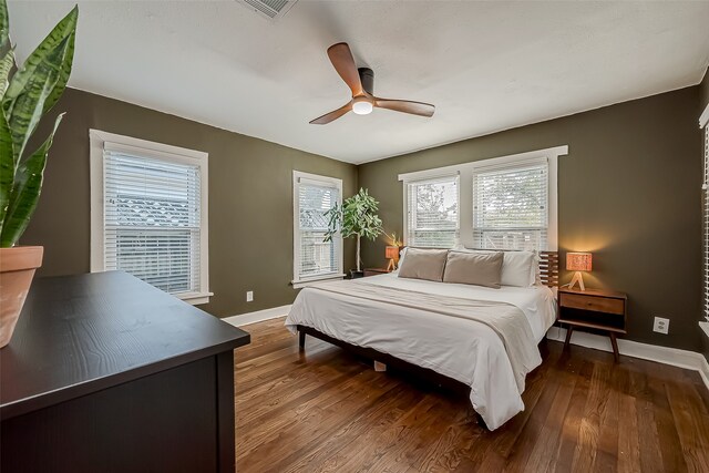 bedroom with wood-type flooring and ceiling fan