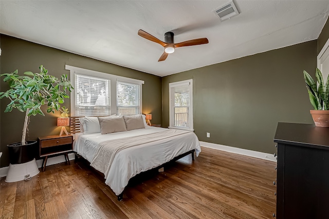 bedroom featuring dark wood-type flooring and ceiling fan