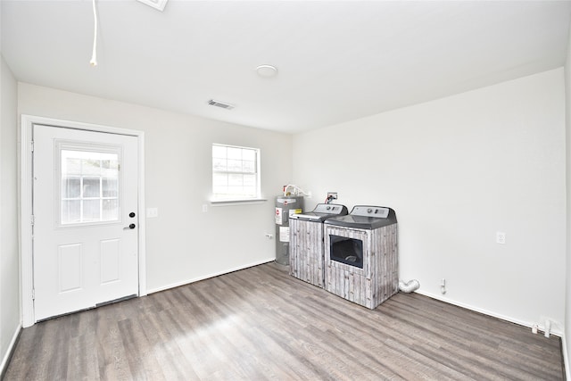 kitchen with water heater, plenty of natural light, and hardwood / wood-style floors