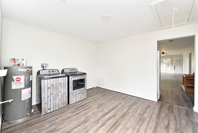 kitchen with washer and dryer, water heater, ceiling fan, white fridge, and hardwood / wood-style flooring