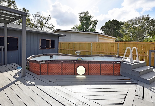 wooden deck with a jacuzzi