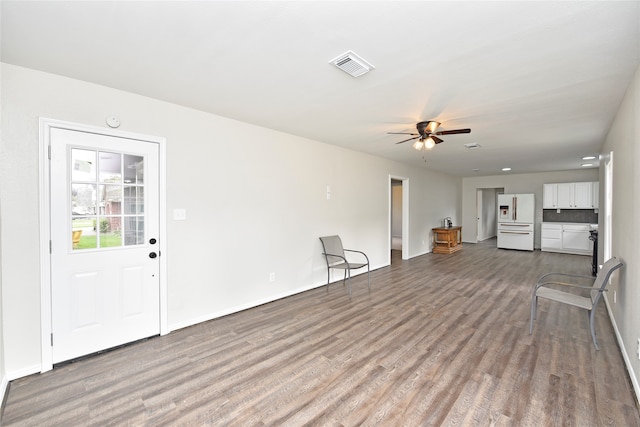 unfurnished living room featuring light hardwood / wood-style floors and ceiling fan