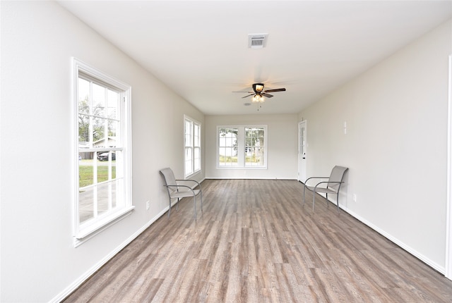 interior space with light hardwood / wood-style flooring and ceiling fan