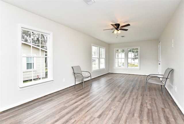 interior space with ceiling fan