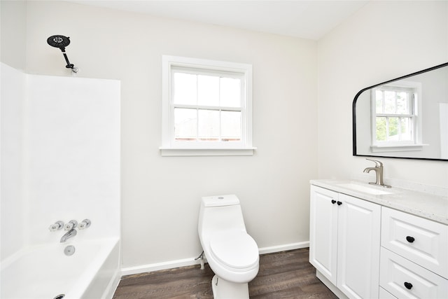 full bathroom featuring vanity, toilet, bathtub / shower combination, and hardwood / wood-style floors