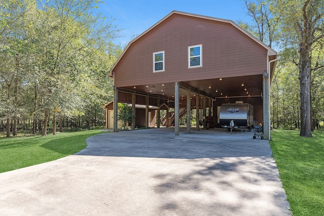 exterior space with a lawn and a carport