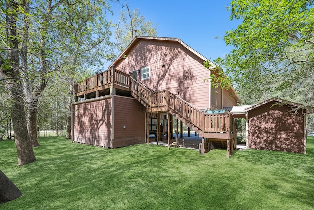 rear view of house with a yard and a deck