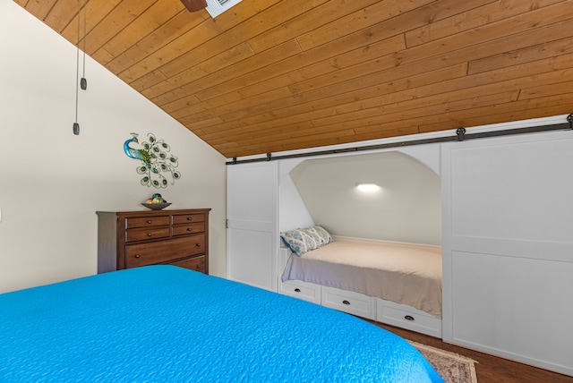 unfurnished bedroom with wood ceiling, wood-type flooring, lofted ceiling, and a barn door