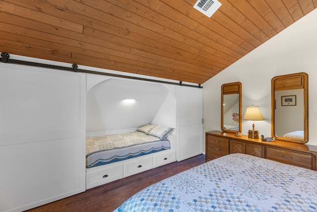 bedroom featuring vaulted ceiling, a barn door, dark wood-type flooring, and wooden ceiling