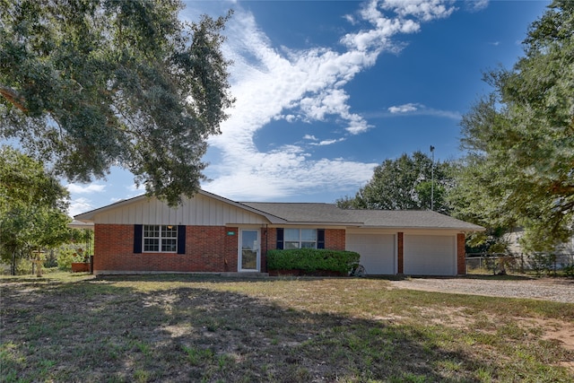 single story home with a front lawn and a garage