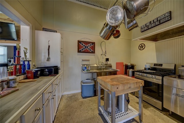 kitchen featuring wooden counters and stainless steel gas stove