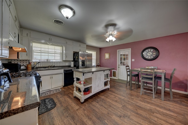 kitchen with white cabinetry, black dishwasher, dark hardwood / wood-style floors, and stainless steel refrigerator with ice dispenser