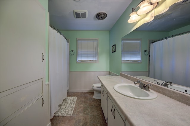 bathroom with vanity and toilet