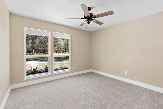 carpeted empty room with ceiling fan