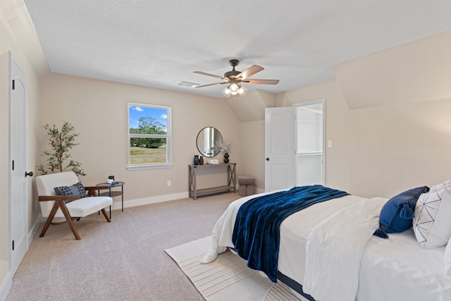 carpeted bedroom featuring vaulted ceiling and ceiling fan