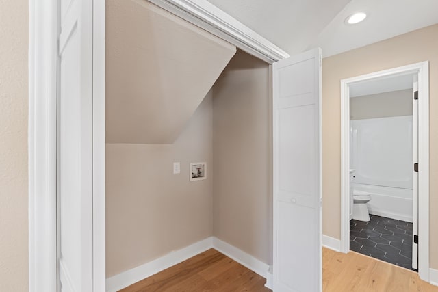 laundry room featuring hookup for a washing machine and hardwood / wood-style flooring