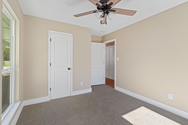 unfurnished bedroom featuring carpet flooring and ceiling fan