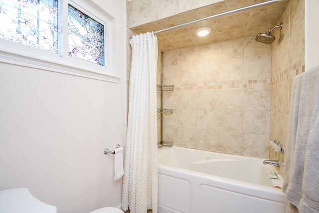 bathroom featuring shower / bathtub combination with curtain