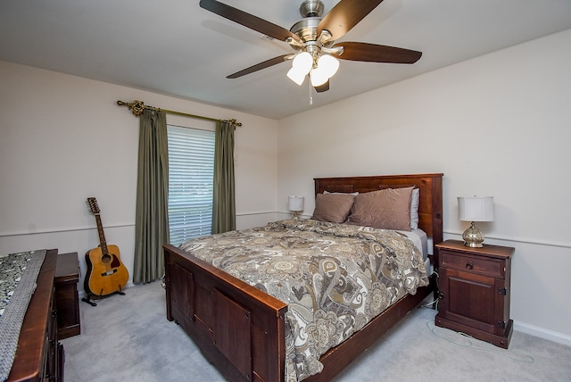 bedroom with light colored carpet and ceiling fan