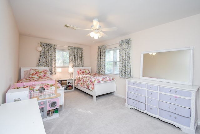 carpeted bedroom with ceiling fan