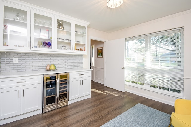 bar with backsplash, white cabinetry, wine cooler, and dark hardwood / wood-style floors