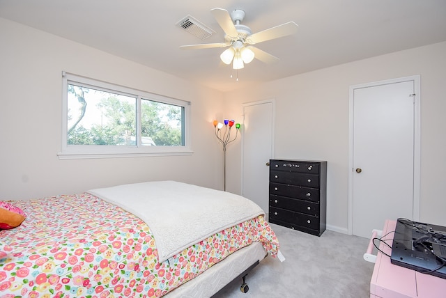 carpeted bedroom with ceiling fan