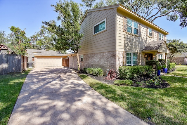 view of front of house with a garage and a front lawn