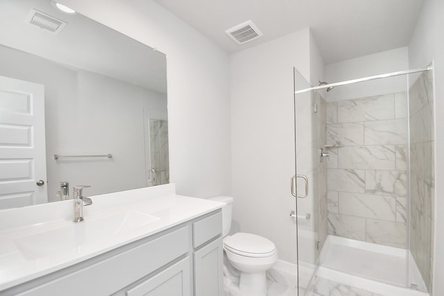 bathroom featuring vanity, toilet, and walk in shower