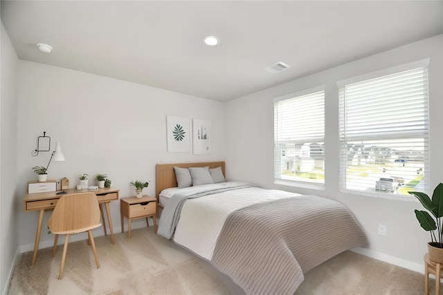 bedroom with light colored carpet