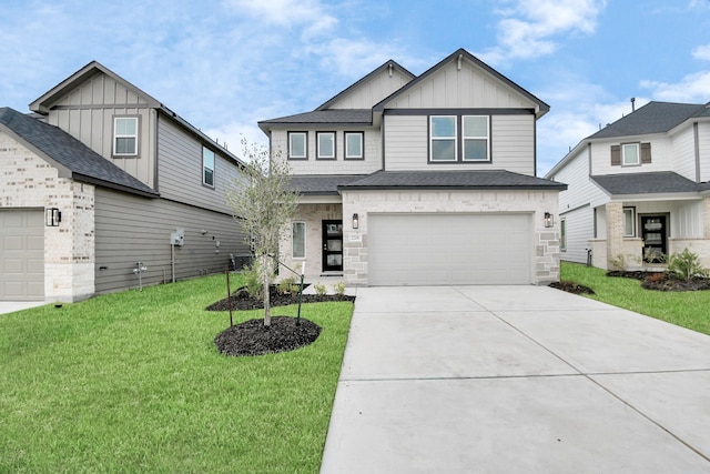 view of front of house featuring a garage and a front lawn