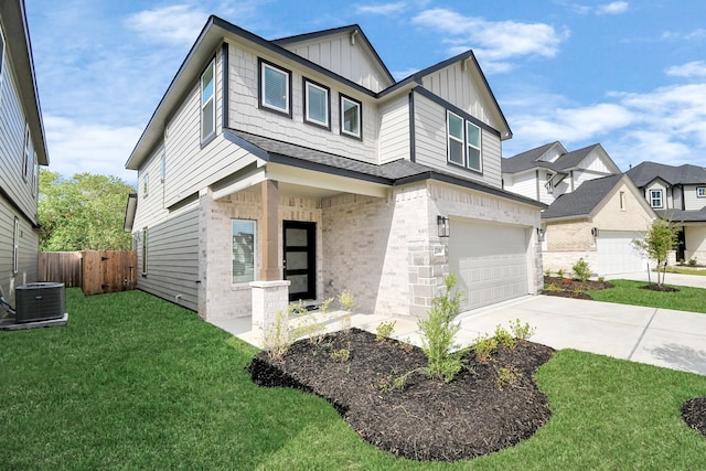 view of front of home featuring a front lawn and a garage